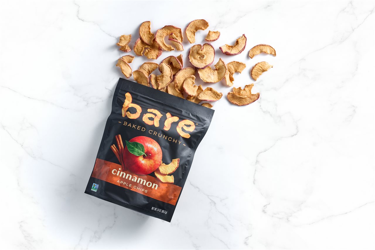 Open bag of Bare apple chips on a white background.