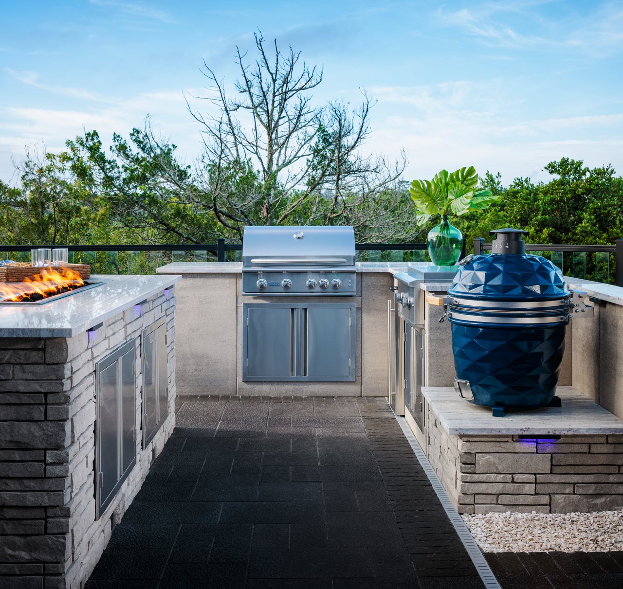 Dream outdoor kitchen with grill, smoker, and island counter with fire feature.