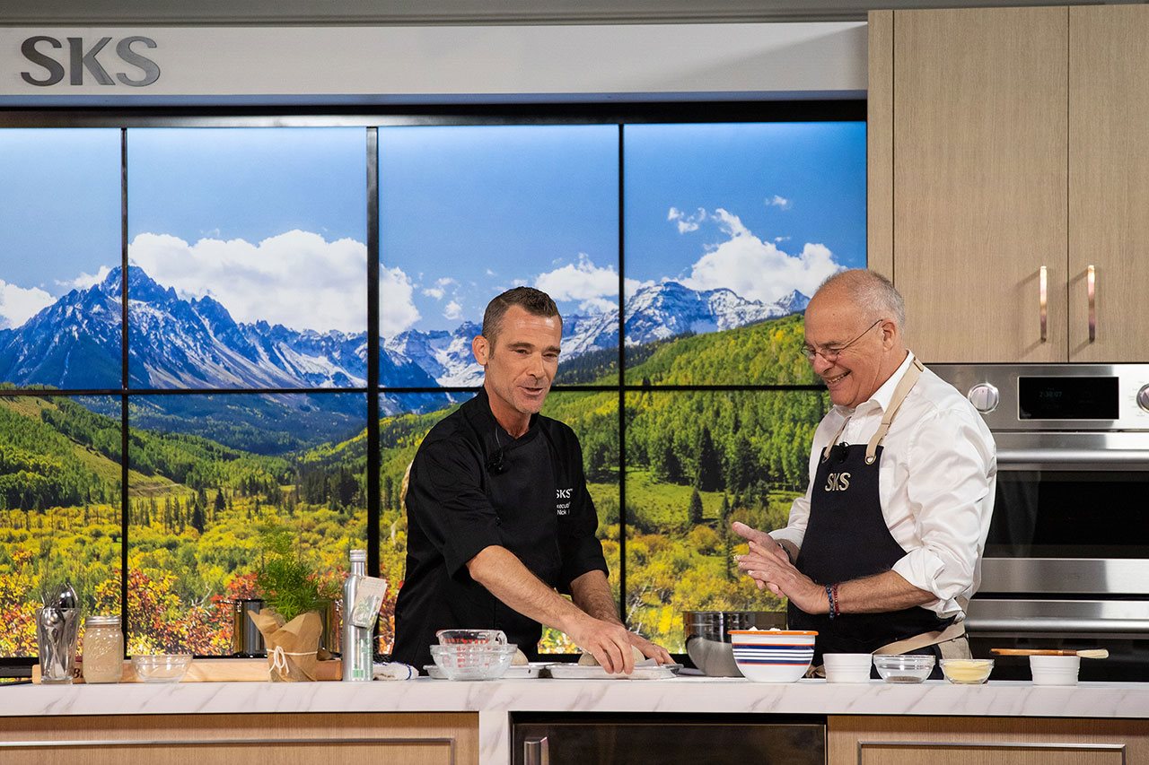 Two chefs making rye bread in the kitchen