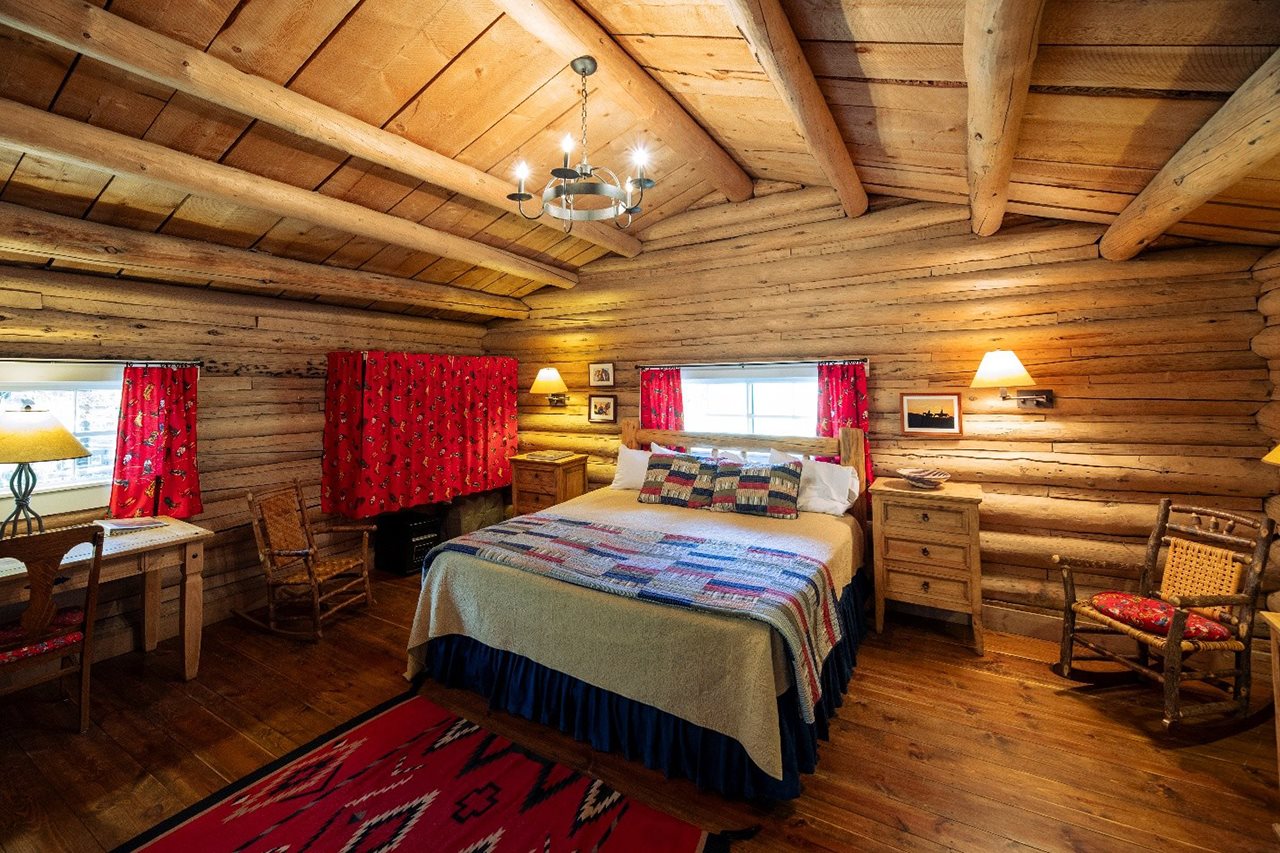 Classic log cabin guest lodge at the CM Ranch.
