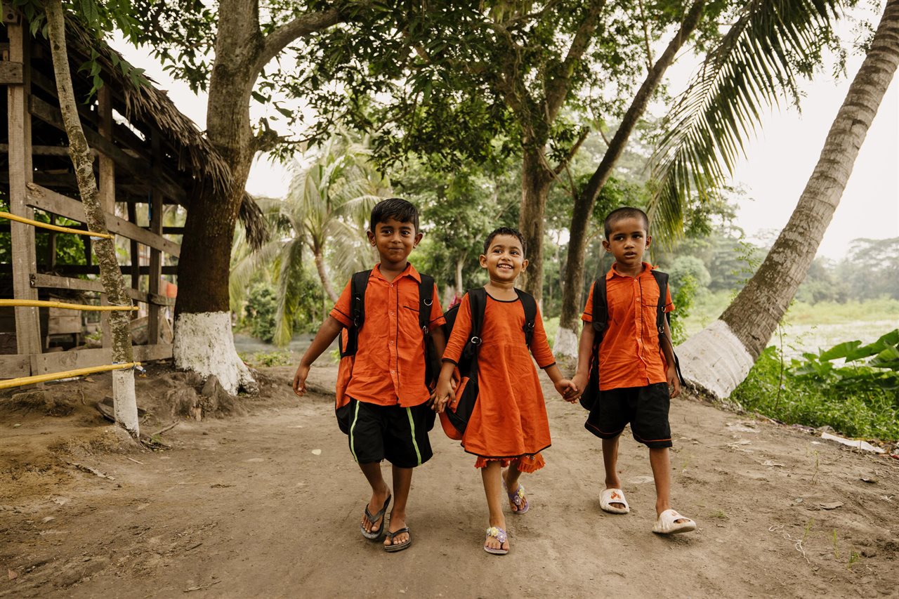 Children walking to school under a child sponsorship program in Wazirpur.