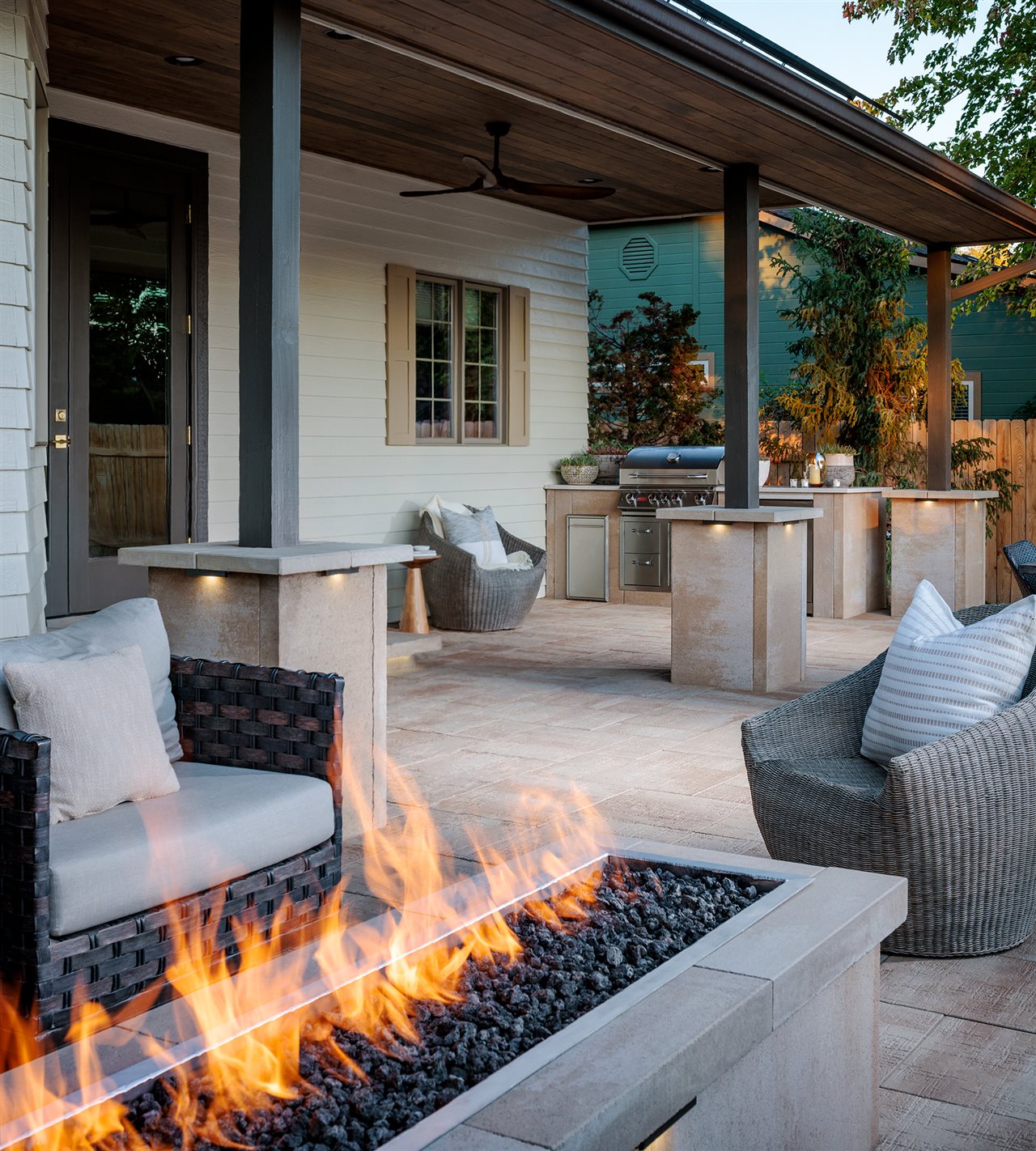 Belgard paver patio with outdoor kitchen and cozy comfortable seating area.