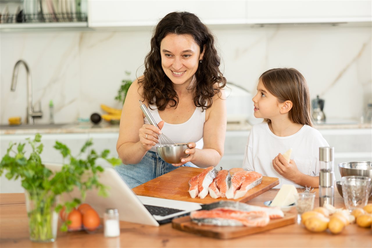 Mother and daughter making a marinade recipe chilean salmon.