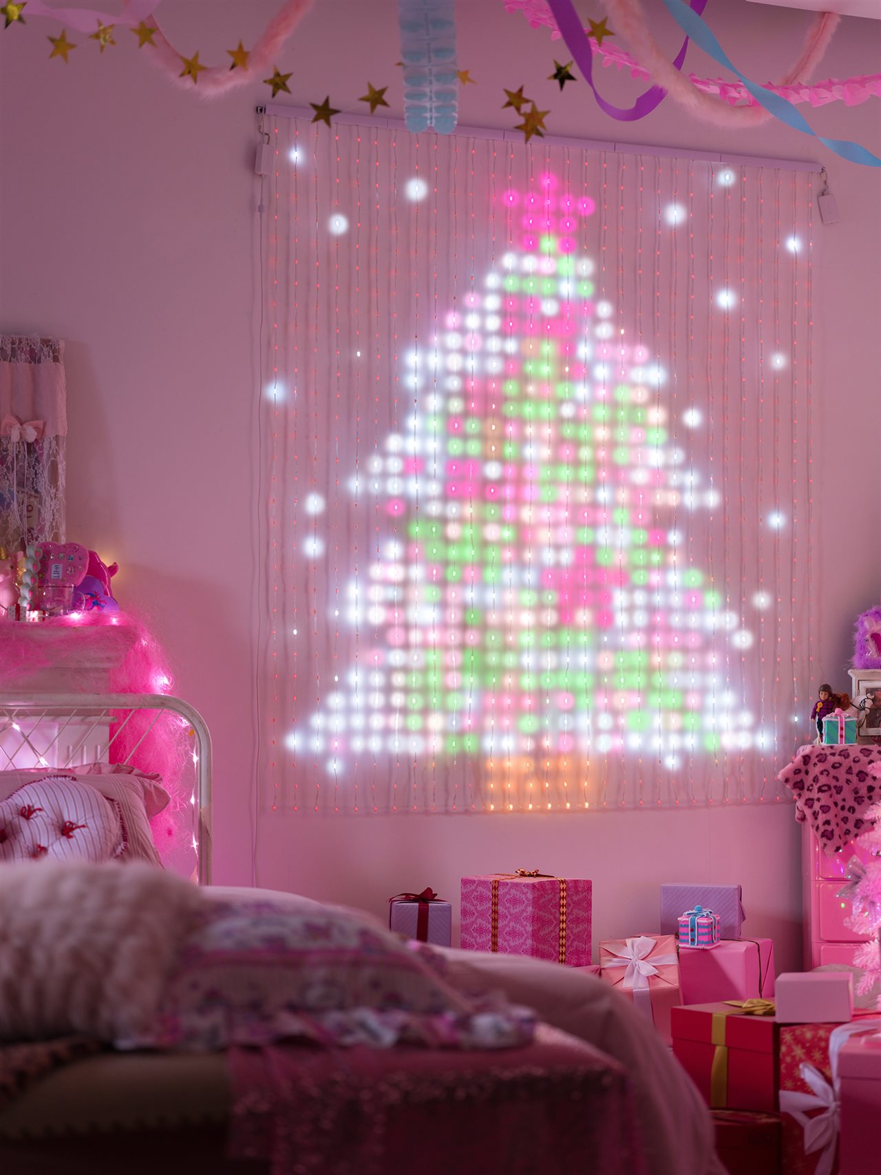 Banner of lights depicting a Christmas tree hangs on a wall.